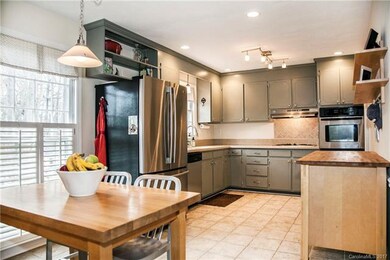 Large eat-in kitchen with a view of the backyard.