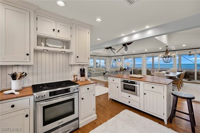 Kitchen with pendant lighting, butcher block count