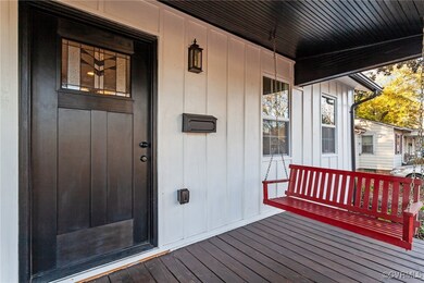 Entrance to property featuring a porch