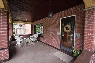 Large 23 ft x 9 ft  covered front porch featuring 
