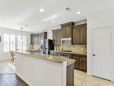 A massive central island provides ample space for 