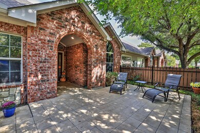 SMALL FRONT PORCH OFF OF THE COURTYARD ENTRY.