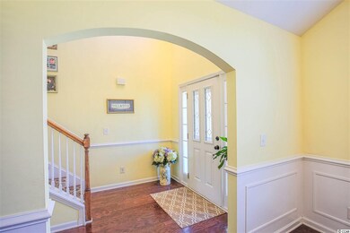 Beautiful arched entrance from foyer leading into 