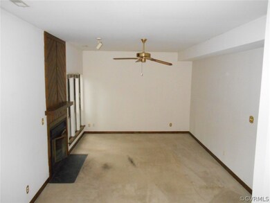 Great room - fireplace and ceiling fan