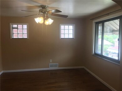 Hardwood floors and ceiling fan in the dining room