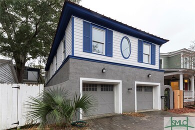 Front of the property.  Note entrance gate on the