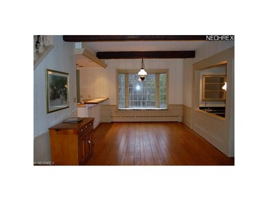 Informal dining area with breakfast bar and bay wi