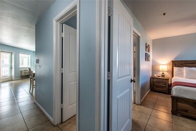 Entryway into unit 536, with bedroom one and bathr
