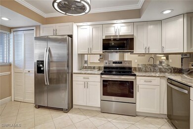 Kitchen with light stone countertops, ornamental m