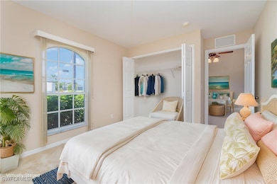 Bedroom featuring a closet, carpet flooring, and b