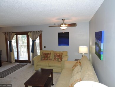 Living room complete with ceiling fan for added co