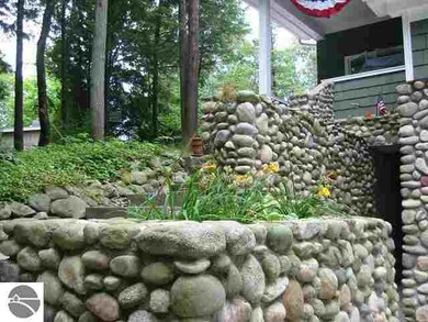 Tons of authentic fieldstone enhance the architect