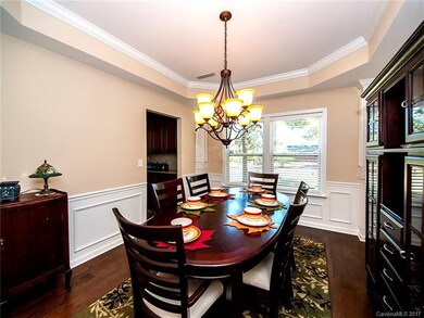 Formal dining with custom trims and tray ceiling. Plenty of space for a large gathering.