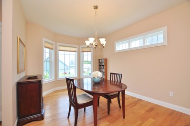 Transom window and bay window adds plenty of light to the formal dining room