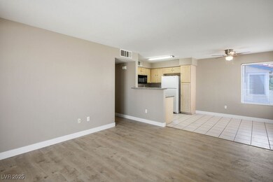 Unfurnished living room featuring light wood-style