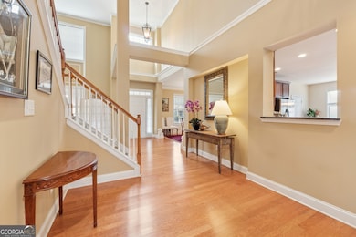2 Story light-filled entry/foyer with gleaming hardwoods.