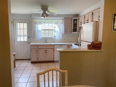Wide open kitchen in all neutral tones with a beau