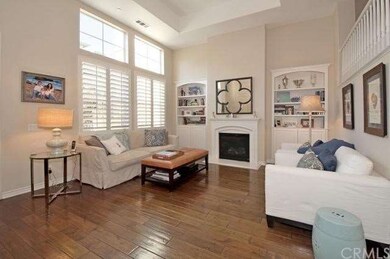 Living room with custom built in bookcases & gas f
