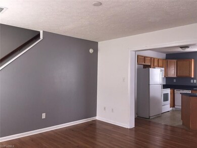 LIVING ROOM LOOKING INTO KITCHEN/DINING AREA