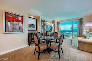 Dining space featuring baseboards and crown molding