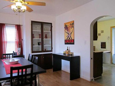 Dining Room. Original built in cabinet.  Archway t