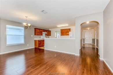 View from dining room into the kitchen and down th