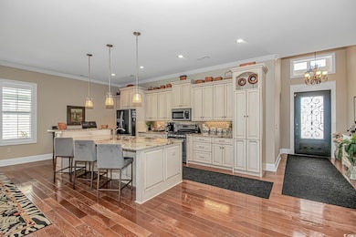 Plenty of natural light, granite countertops, SS appliances, and breakfast bar