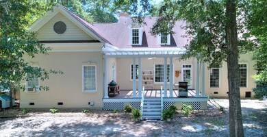 Inviting Back Deck with Arbor