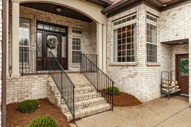 The beautiful covered front porch invites you to come in!