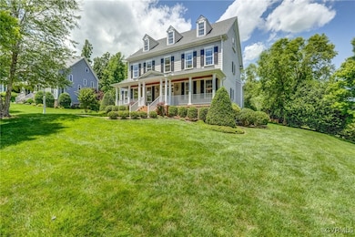 Charming covered front porch with stately architec