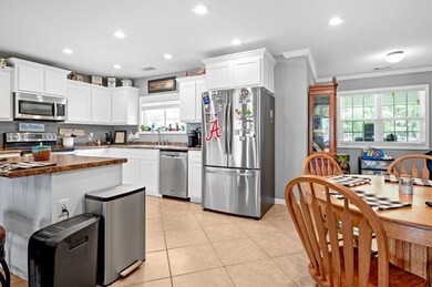 The lovely kitchen also features tile flooring and