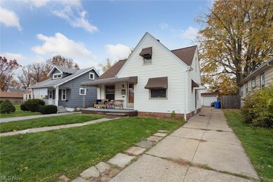 Bungalow featuring a front yard and covered porch