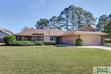 Full brick home with fenced yard, manroom, carport