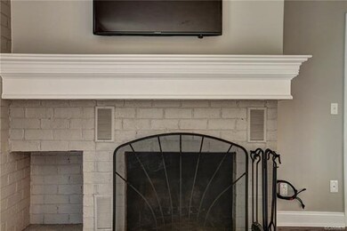 Gorgeous custom mantel added so heat from fireplac