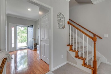 Sun shines onto the hardwood floors in the Entry.  Note the coat closet.