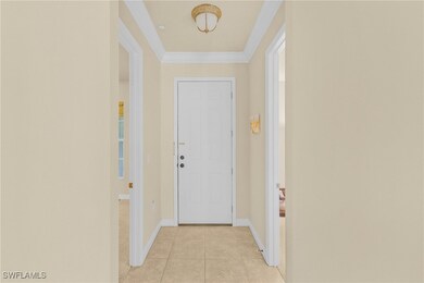 Entryway with light tile patterned floors, ornamen