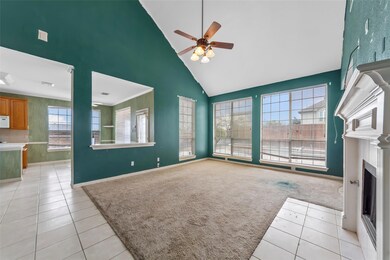Unfurnished living room featuring high vaulted cei