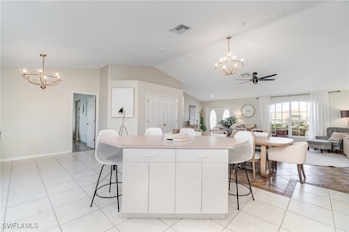 Kitchen featuring a chandelier, open floor plan, a