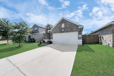 This is a modern brick home with a spacious drivew