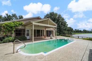 This inspiring single-story brick home offers brea