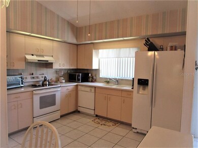 Eat in Kitchen has tile flooring, cathedral ceilin