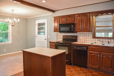 The kitchen opens to the dining room.