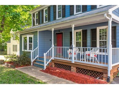 Aggregate walkway and beautiful front porch.