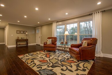 Upon entering the front door, you will see a beautiful big front window that lets in lots of natural light throughout the main living area. 