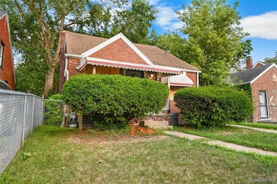 View of front of property featuring roof with shingles and brick siding