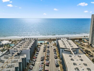 Birds eye view of property with a water view and a