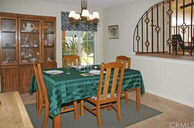 Formal dining room with Travertine-style tile floo