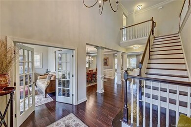 Two Story Foyer with Wide Plank Hardwood Floors
