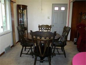 Dining area with large window overlooking the back