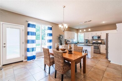 Freshly painted white cabinets with Granite Counte